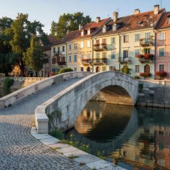 Pedestrian bridge and riverside buildings in central Ljubljana
